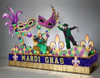 Mardi Gras parade float with oversized masquerade masks, fleur-de-lis accents and colorful bead decorations