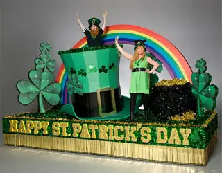 St. Patrick's Day parade float with rainbow, shamrocks, leprechaun hat and festive green accents