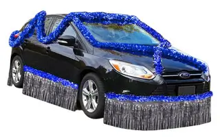 Black sedan decorated with blue and silver metallic fringe trim kit
