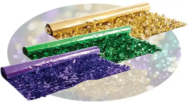 Rolls of metallic foil shreds in gold, green, and purple.